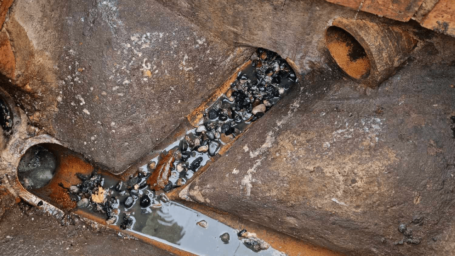 A photo of blocked drain after with rubble and fatty build up removed by a drain jetter