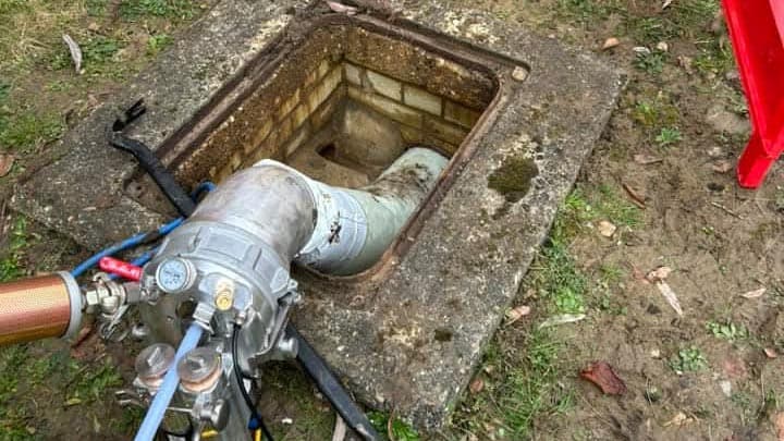 Diagram showing the drain lining process where a new sleeve with epoxy resin creates a smooth inner surface within the existing damaged drain pipe